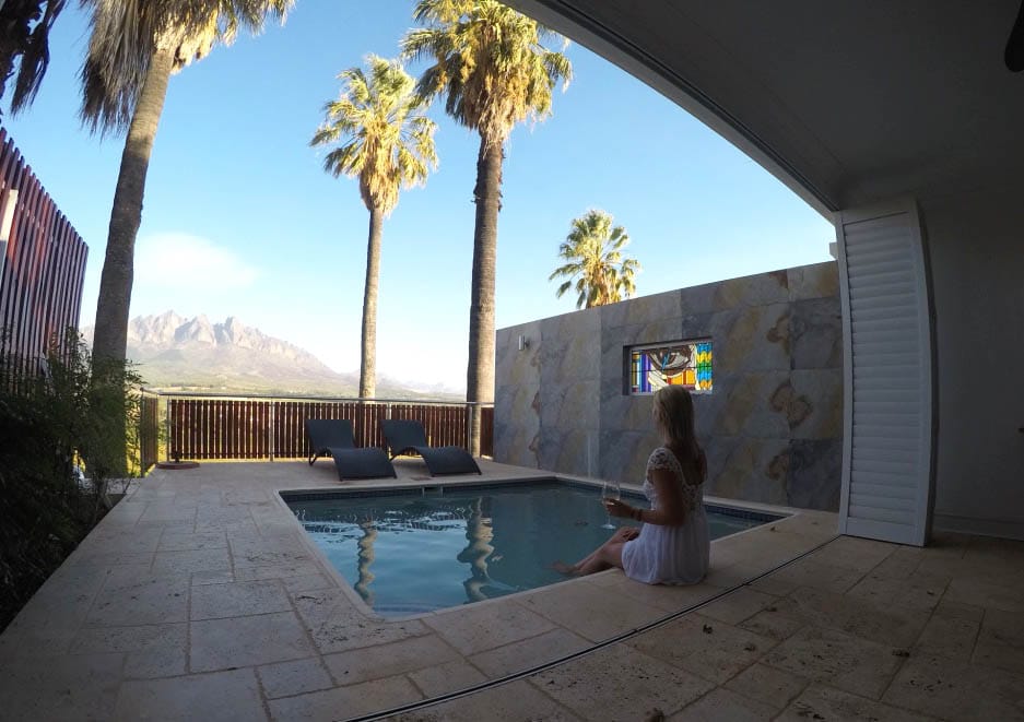 drinking wine in the pool with magnificent views over the mountains